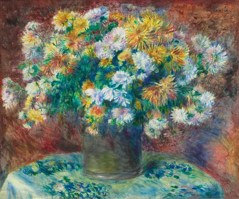 A loose bouquet of yellow, orange, and white chrysanthemums