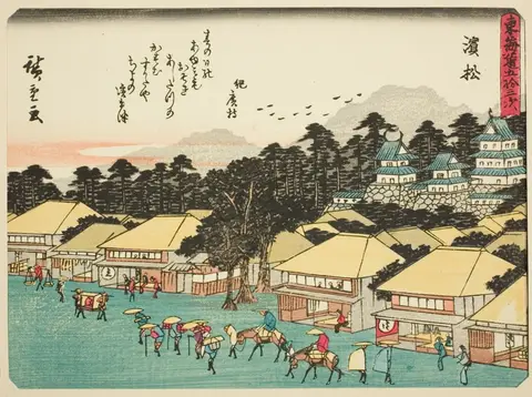 Villagers around a bonfire under a bare tree at night with Mount Fuji