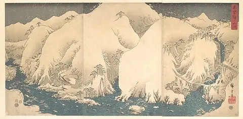 Wide view of pale snow-covered mountain peaks with a thin blue band below