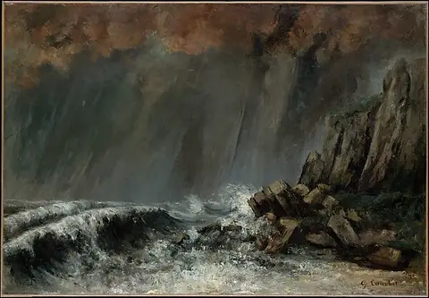 A dark stormy sea with a white wave breaking on rocks under heavy clouds