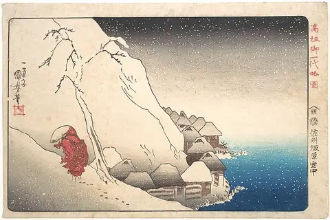 A snow-covered cliff with a small hut above a deep blue sea
