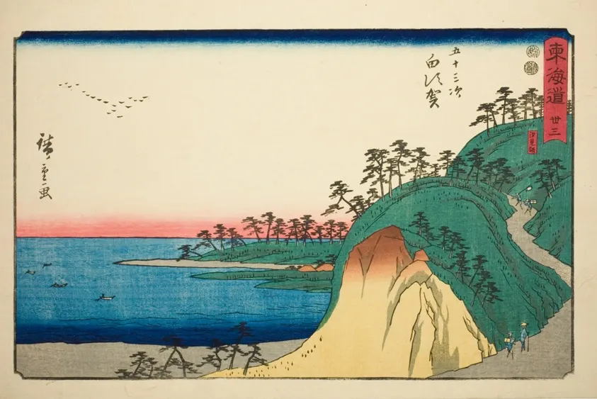 Travelers on a coastal path above the sea